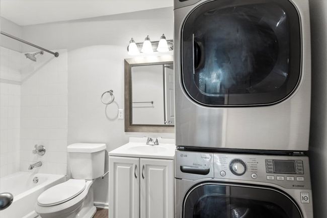 Private bath in front bedroom with stackable washer/dryer hookups | Image 16
