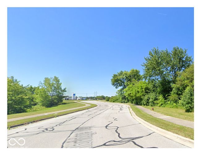 view of asphalt street with sidewalks and curbs | Image 5