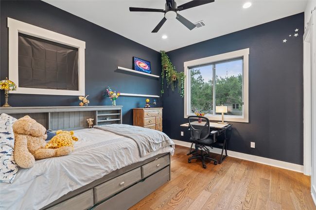 Bedroom with light wood-type flooring, recessed lighting, baseboards, and a ceiling fan | Image 26