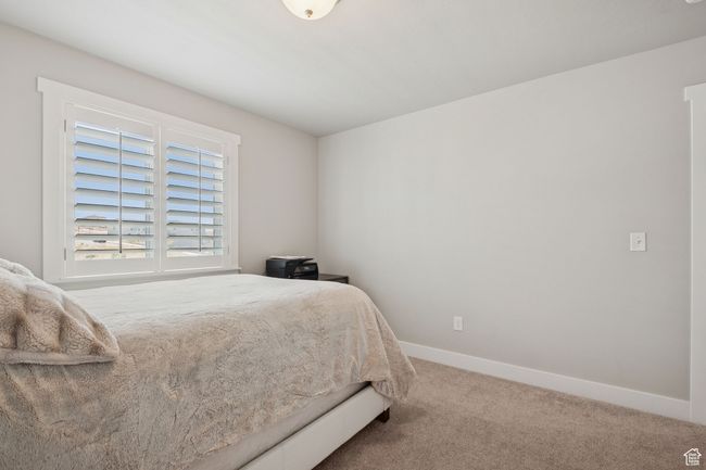 Carpeted bedroom with baseboards | Image 25