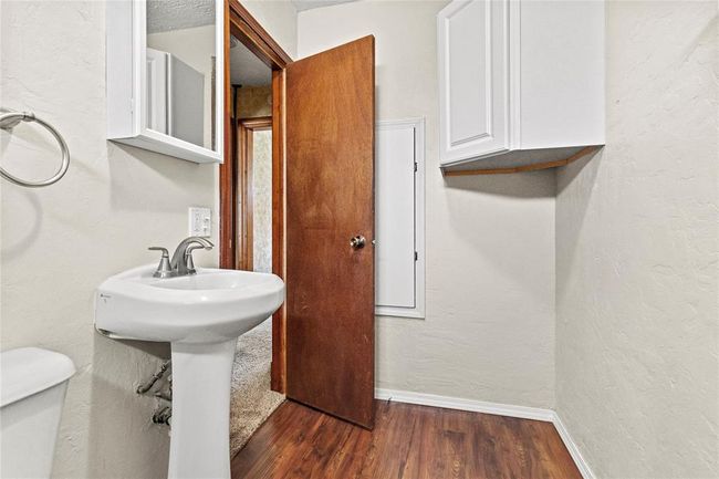 Bathroom with hardwood / wood-style flooring and toilet | Image 19