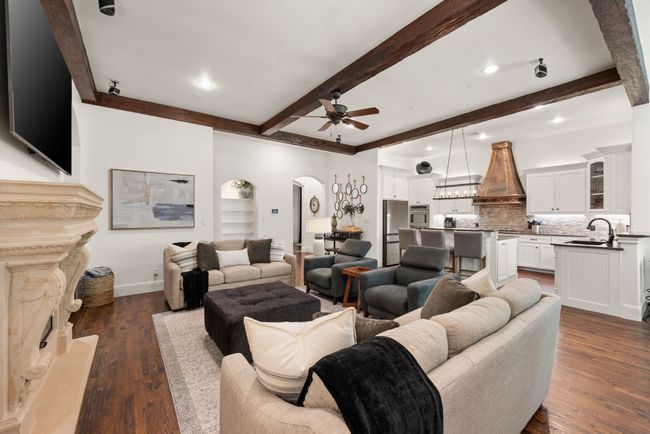 Another view of the Living area. Surround sound speakers convey. The home has an interior sprinkler system. | Image 9