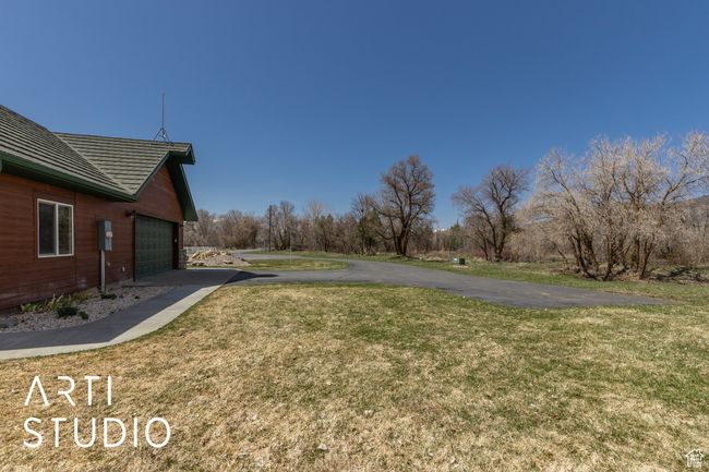 View of yard featuring driveway and a garage | Image 51
