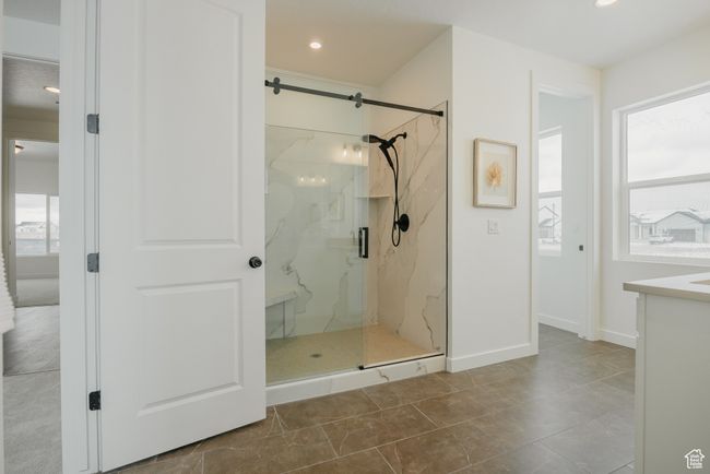 Bathroom featuring a marble finish shower, vanity, recessed lighting, and baseboards | Image 28