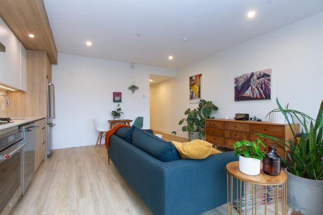 Living room with baseboards, light wood finished floors, and recessed lighting | Image 4