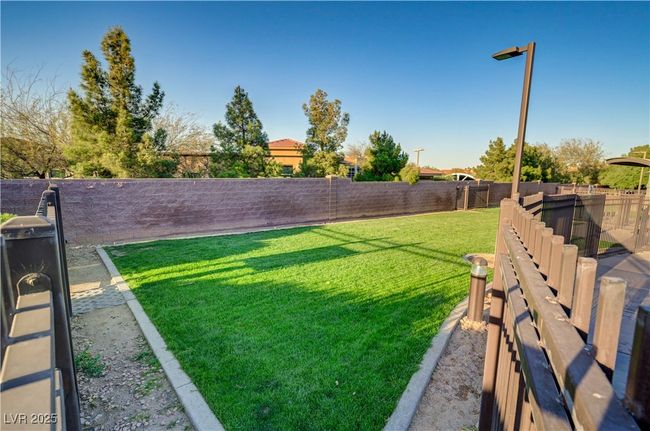 View of yard with a fenced backyard | Image 33