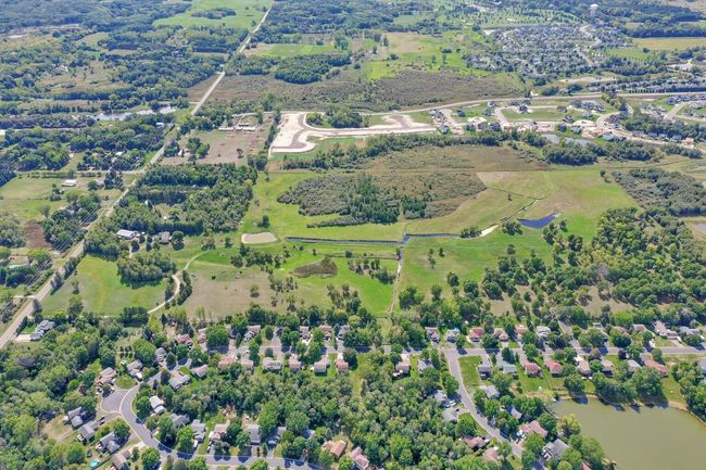 Property runs left to right and is in this Southern facing photo. Goodview on the left side. Housing development along the North boarder. Water canal in the center of the 70 acres. | Image 5