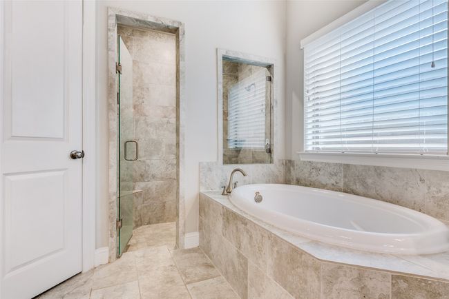 Bathroom with a garden tub and a shower stall | Image 16