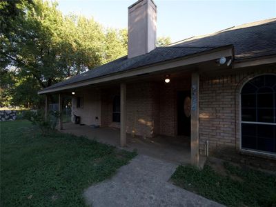 View of home's exterior featuring a patio area and a yard | Image 2