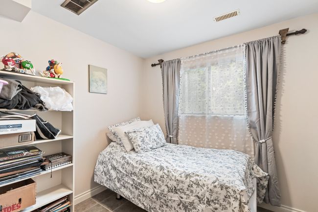 Bedroom with baseboards and tile patterned flooring | Image 34