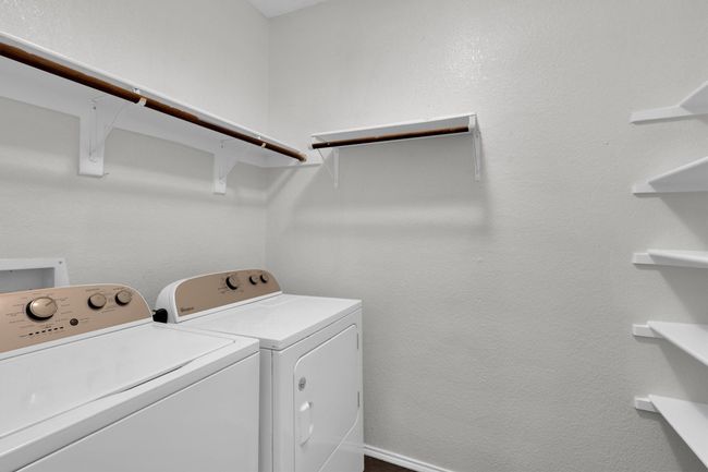Washroom featuring washing machine and dryer | Image 13