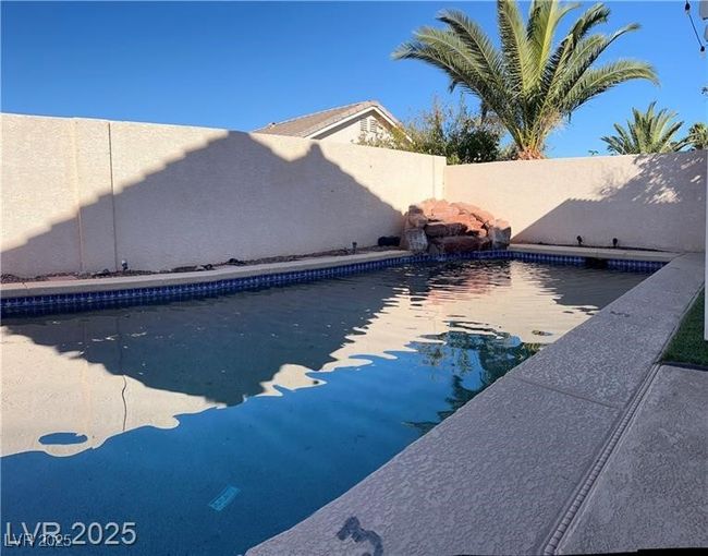 View of pool featuring a fenced in pool and a fenced backyard | Image 13