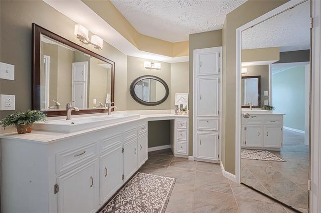 Spacious and bright primary bathroom. | Image 19
