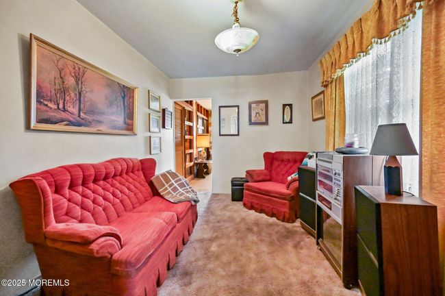 Bedroom on the lower level being used as a den | Image 17