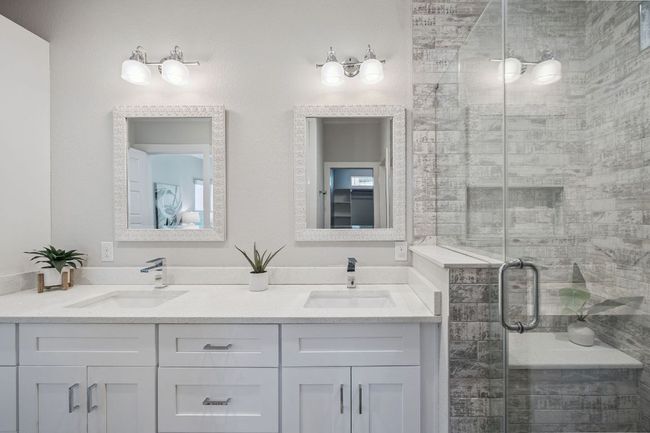 Full bathroom featuring double vanity and a shower stall | Image 23