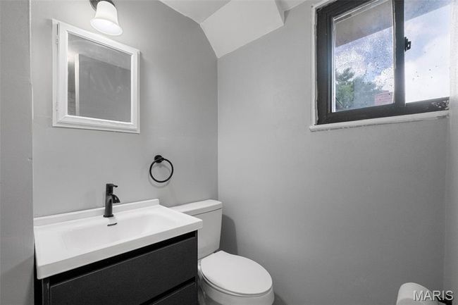 Bathroom with toilet and vanity | Image 12