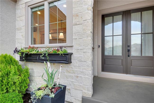 Doorway to property featuring french doors and stone siding | Image 5