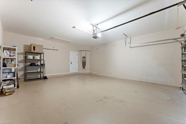 Garage with a garage door opener | Image 34