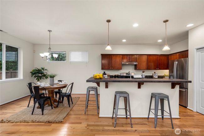 sprawling kitchen/dining area flows seamlessly out to the back patio and into the large living room! | Image 11
