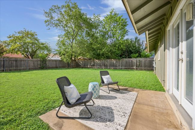 Fenced backyard featuring a patio area | Image 31