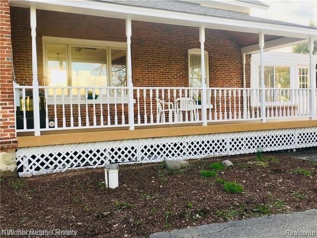 Covered porch over looking the lake | Image 5