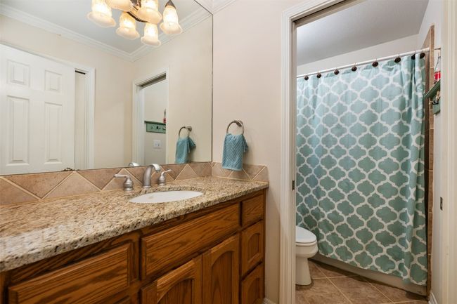 Between the two upstairs bedrooms is a full bath. | Image 27
