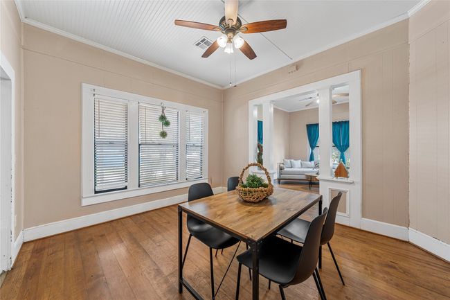 Dining area featuring ceiling fan, ornamental molding, and wood-type flooring | Image 13