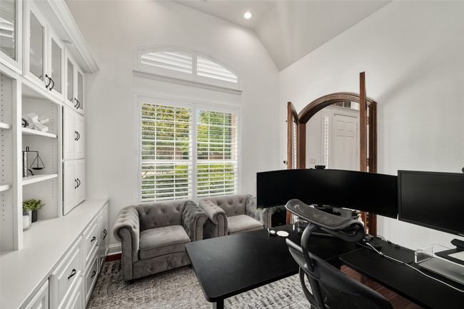 Home office with lofted ceiling | Image 10