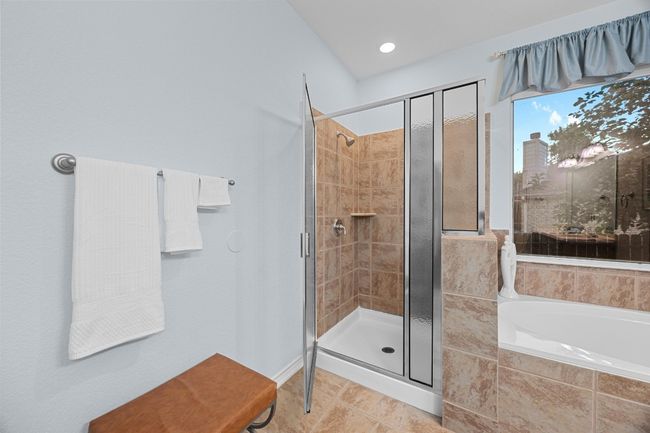 A close view of the walk-in shower in the primary bathroom. | Image 24