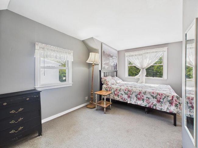 Bedroom with carpet and vaulted ceiling | Image 17