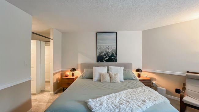 Bedroom featuring baseboards, carpet, and a textured ceiling | Image 12
