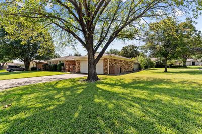 Single story home with a garage and a front law | Image 2