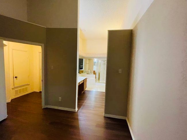 Corridor featuring dark wood-type flooring and baseboards | Image 13