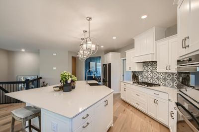 (*Photo of decorated model, actual homes colors and finishes will vary) Imagine preparing a meal for friends and loved ones in this kitchen | Image 3