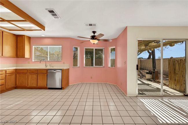 Kitchen with visible vents, light countertops, dishwasher, and light tile patterned flooring | Image 12