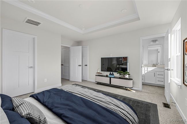 Bedroom featuring baseboards, light carpet, crown molding, and visible vents | Image 21