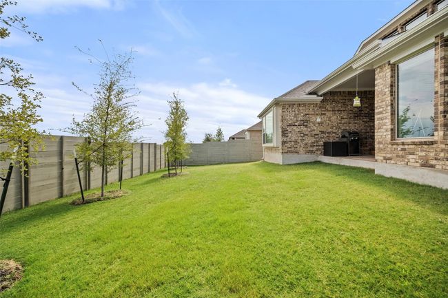 View of fenced backyard | Image 37