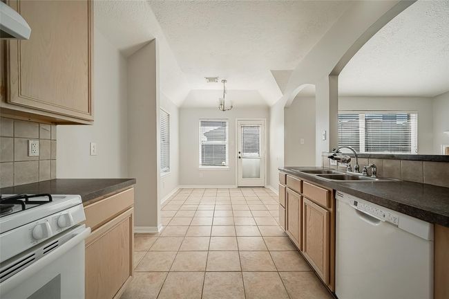 Open concept kitchen extending into the breakfast area | Image 10