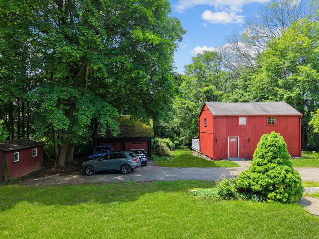 The freshly painted barn has electricity and a 2nd floor. It will make a great workshop, crafting space, art studio. | Image 5