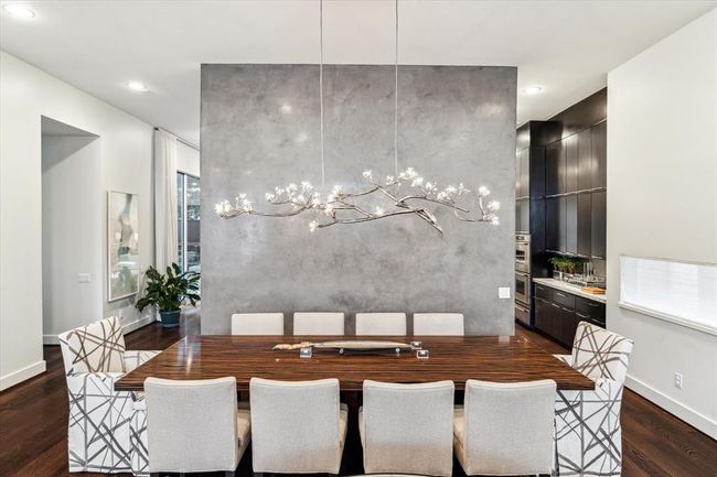 View from the Living Room opening to the Dining Room exhibiting the striking and masterfully painted wall separating the spaces from the Butler's Pantry and Kitchen areas. How eye catching! | Image 8