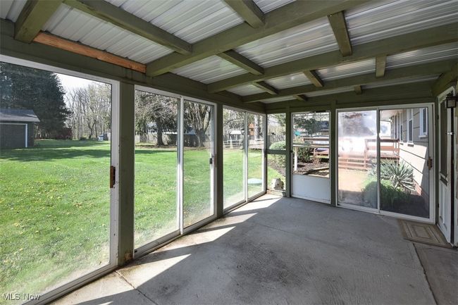 View of unfurnished sunroom | Image 11