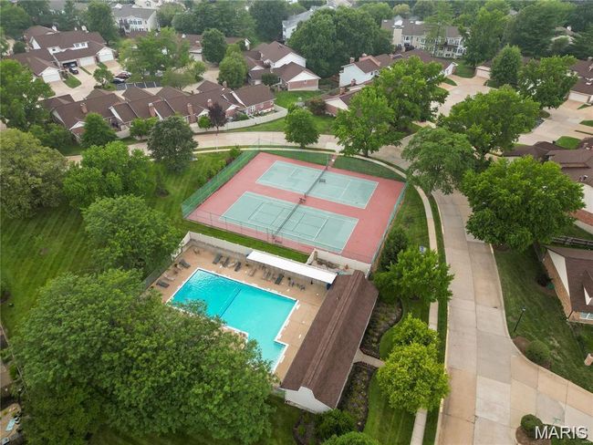 Aerial view of residential area with a pool | Image 25