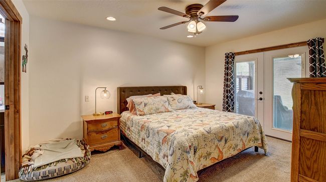 Bedroom with light colored carpet, access to exterior, recessed lighting, and a ceiling fan | Image 18