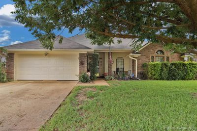 Single story home with a garage and a front yard | Image 2