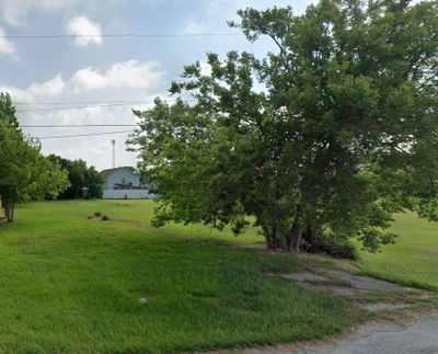 cleared lot. mature trees | Image 1