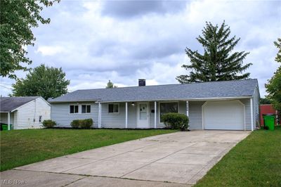 Single story home with a garage and a front lawn | Image 2