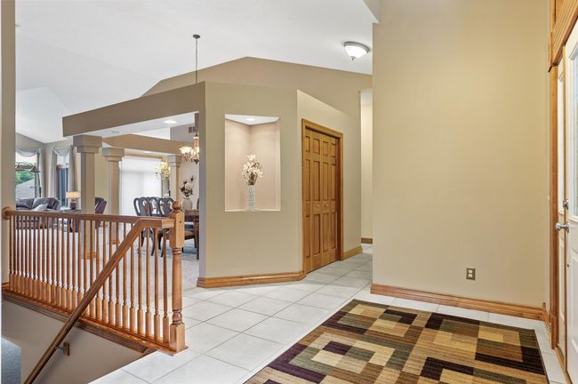 Upon entering you will experience how impressive and spacious this townhome is with soaring 10'+ ceilings and quality finishes & craftsmanship throughout. | Image 8
