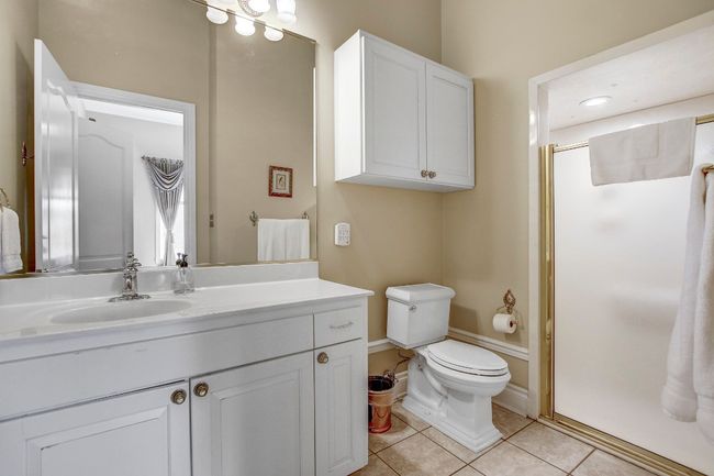 Full bath with vanity, a shower stall, and tile patterned flooring | Image 24
