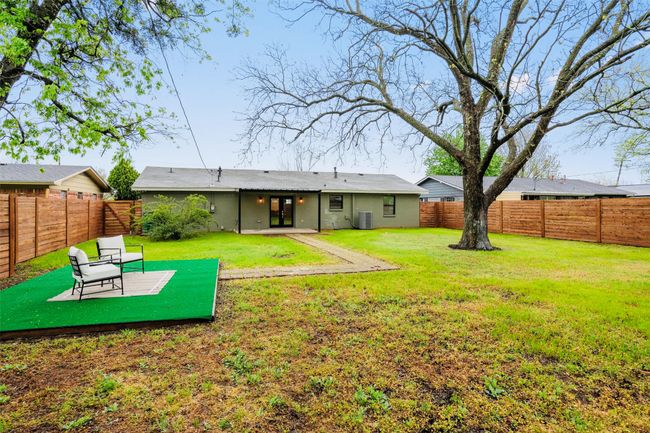 Rear view of property featuring a patio area and a fenced backyard | Image 40