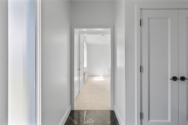 Hallway with marble finish floor and baseboards | Image 37